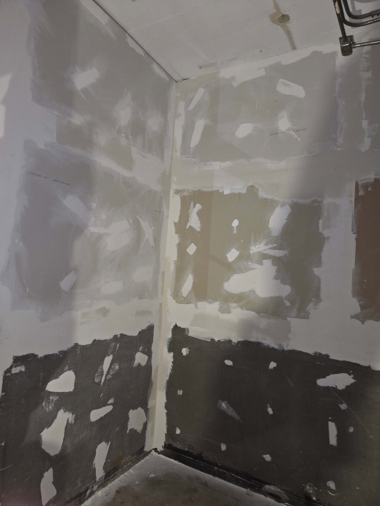 Commercial drywall corner mud detail during finish preparation