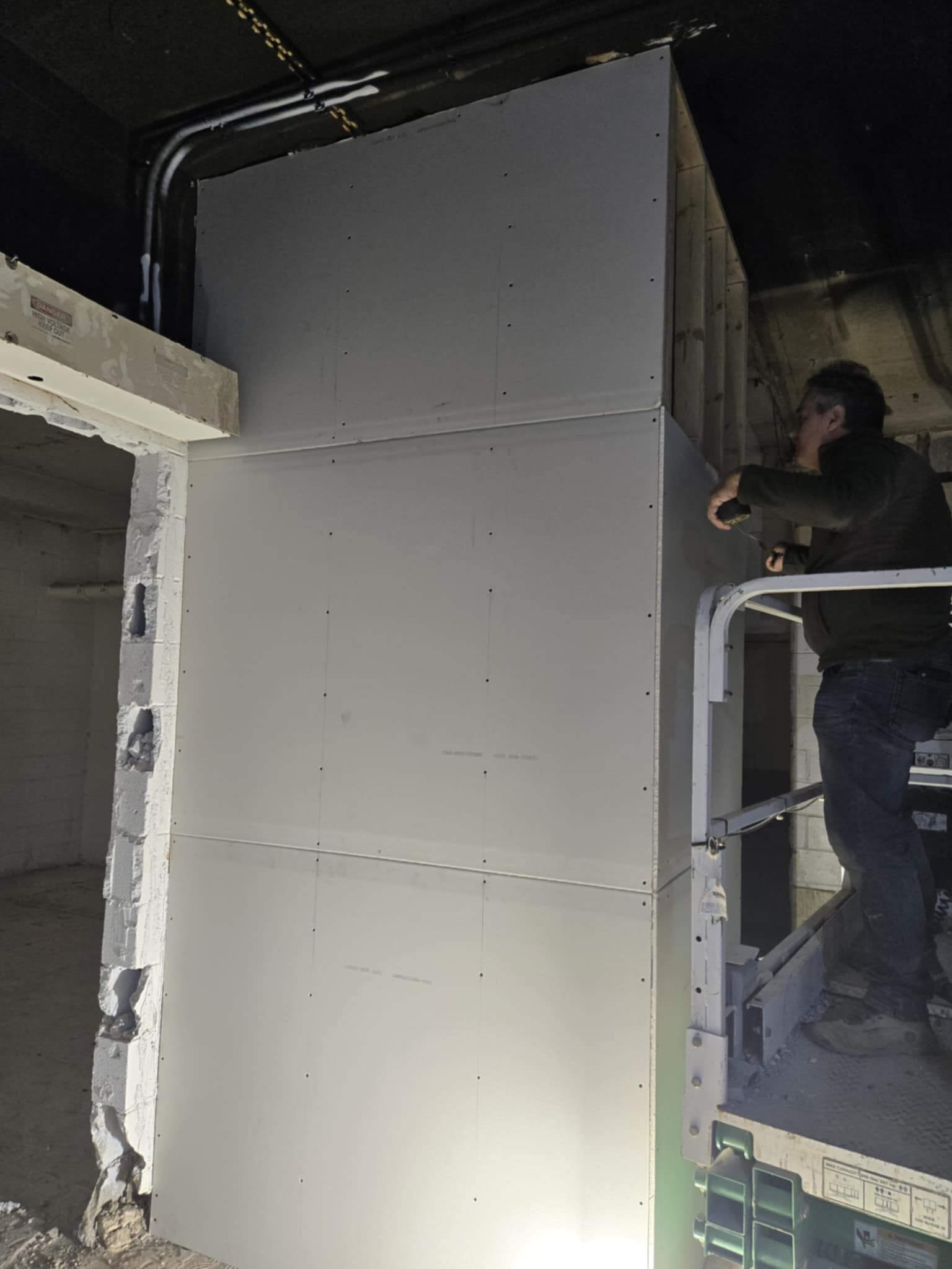 Large commercial wall drywall installation and interior preparation