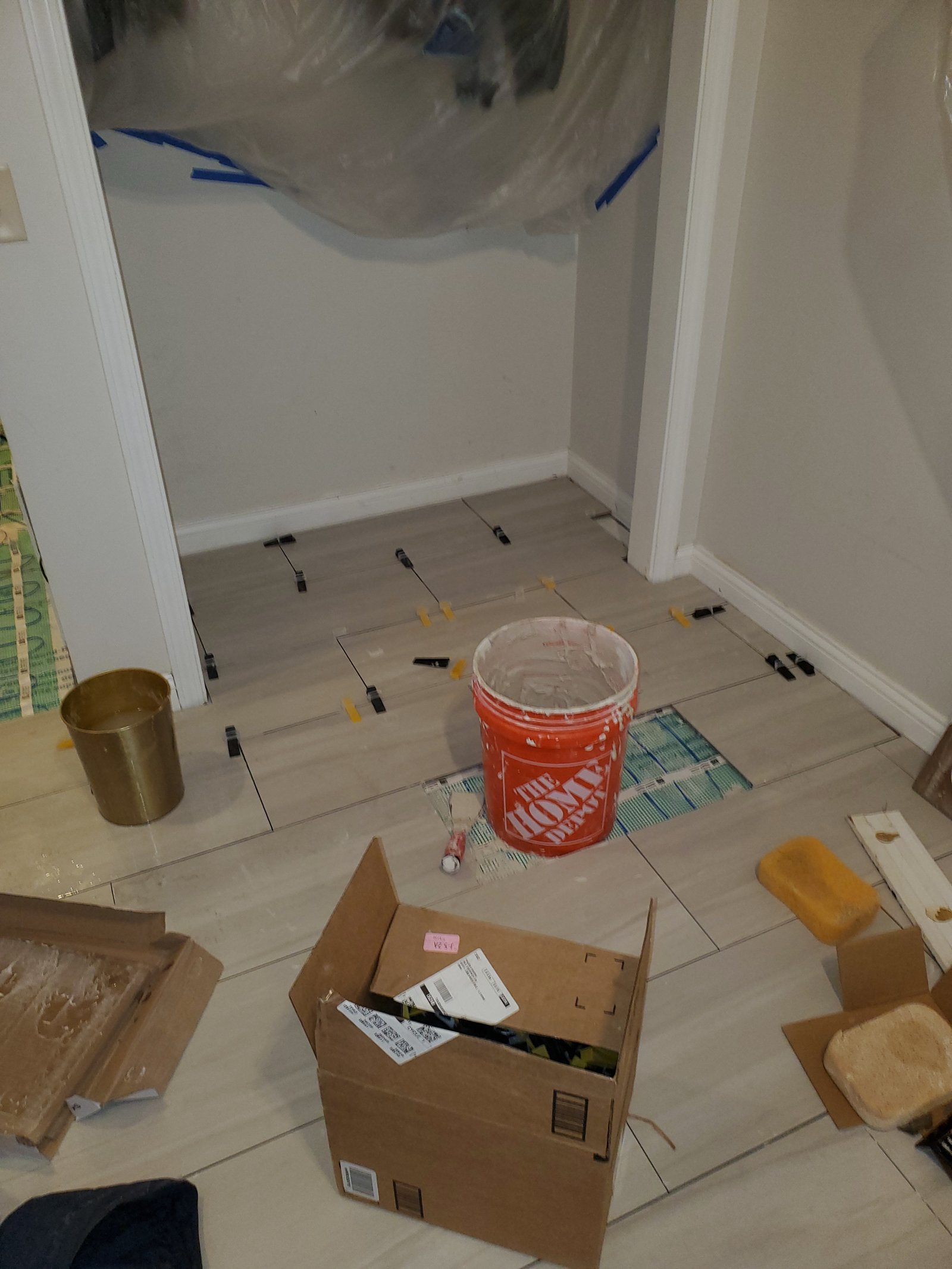 Large-format wood-look floor tile installation with spacers
