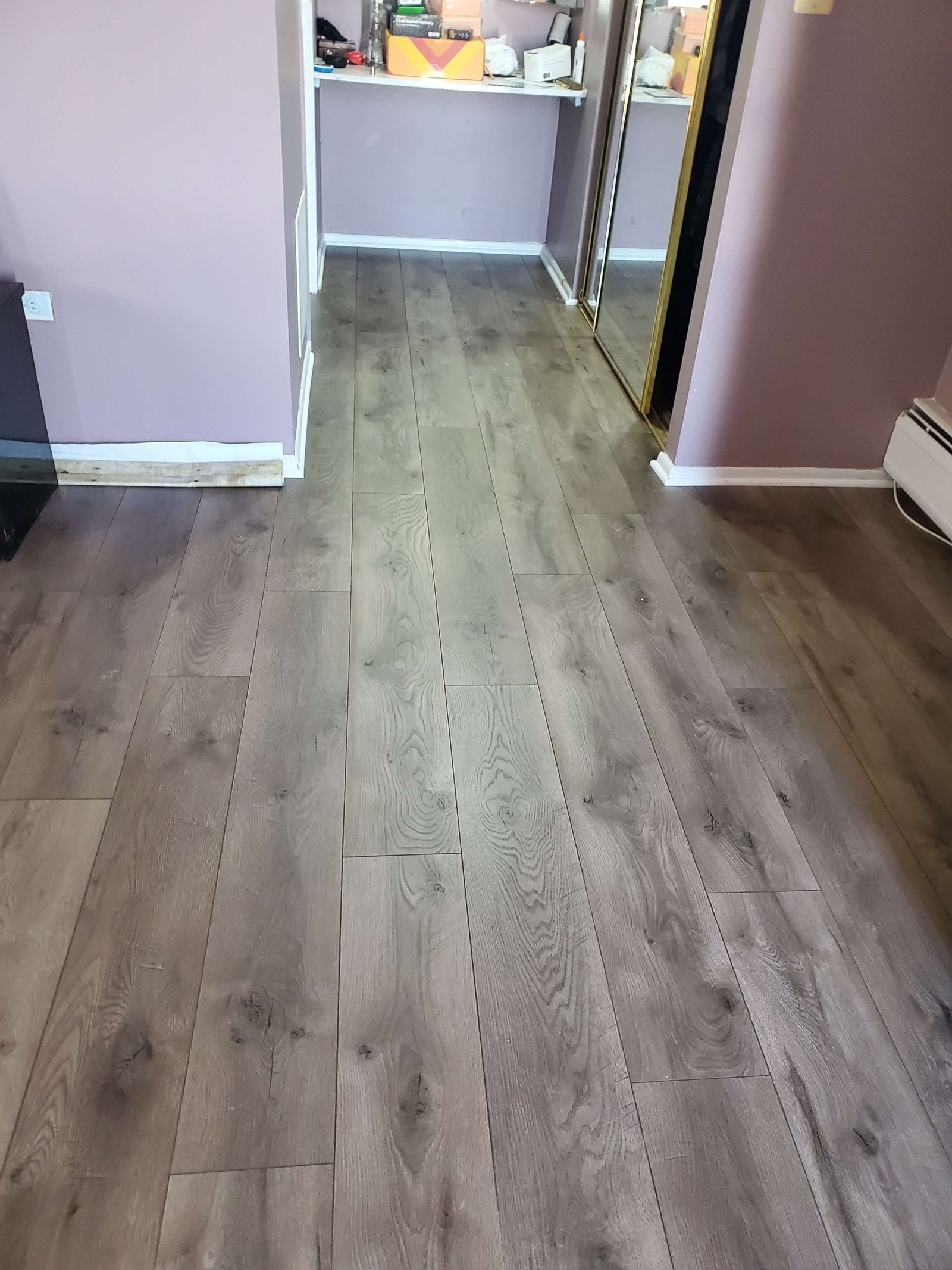 Hardwood flooring installed across bedroom and hallway areas