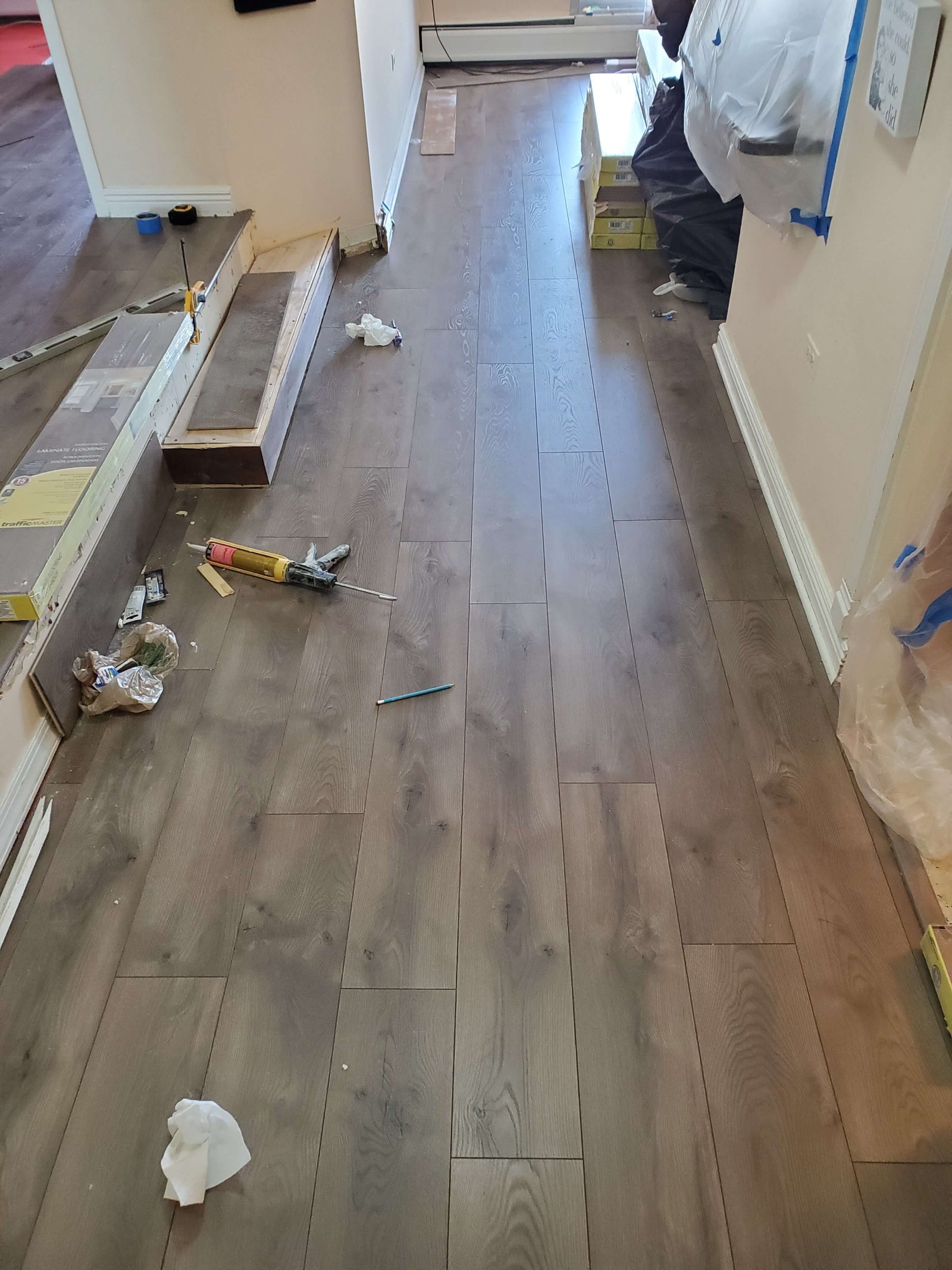 Wide-plank hardwood flooring installation in progress